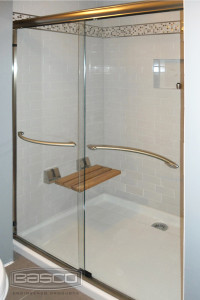 Infinity Frameless Sliding Shower Door featuring Bronze Finish and 1/4" Clear Glass with optional Arched towel bars.